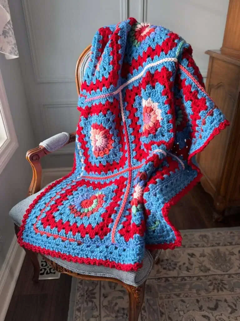 Crochet sunburst granny squares joined into a scrap afghan